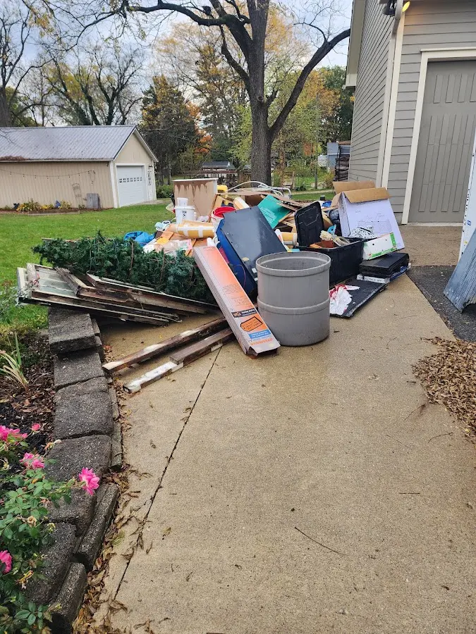 Dumpster being loaded with debris for Commercial Dumpster Rental in Columbia